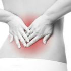 Почему болит поясница у женщин: причины болей в спине