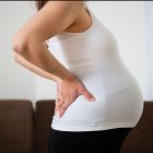 Боли в спине при беременности на разных сроках: причины, лечение, полное описание проблемы